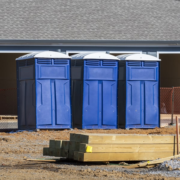 what is the cost difference between standard and deluxe portable restroom rentals in Harrison AR